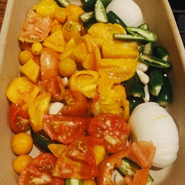 tomatoes, peppers,onions, garlic in pan to make salsa.