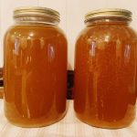 Two gallon jars of broth