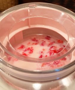 strawberry ice cream in ice cream maker 