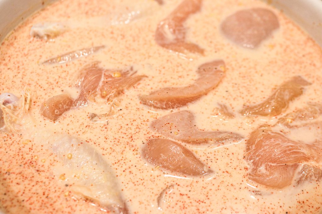 raw chicken in buttermilk marinade
