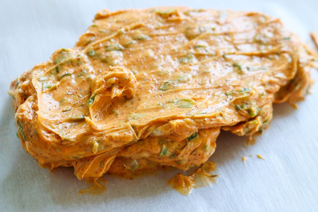 compound butter log on parchment paper