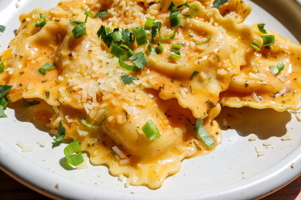 lobster ravioli with butter sauce, parsley and chives