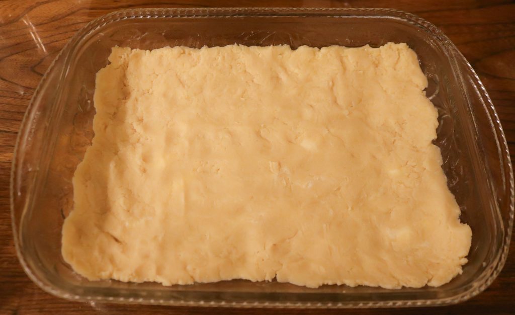 shortbread dough pressed into a 9x13 pan