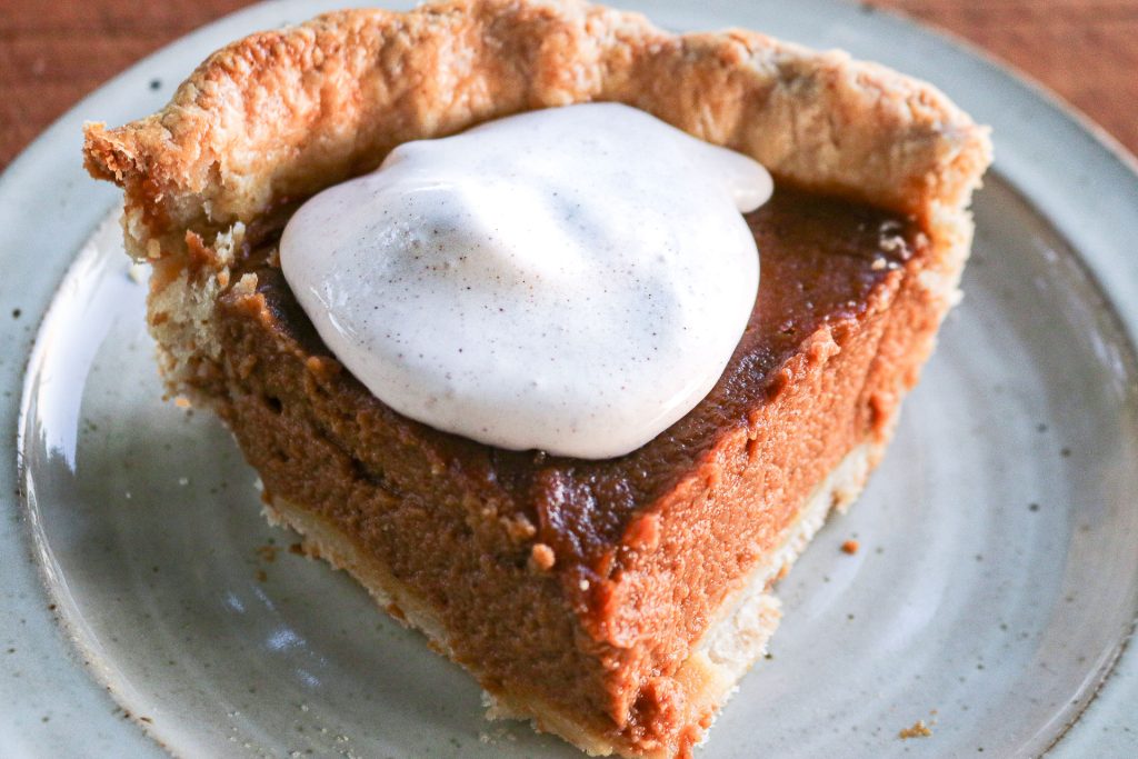 slice of apple butter pumpkin pie with cool whip