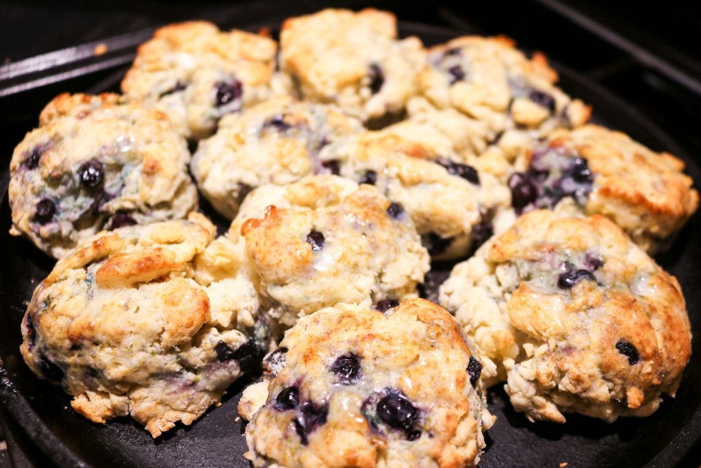 cast iron skillet of blueberry biscuits